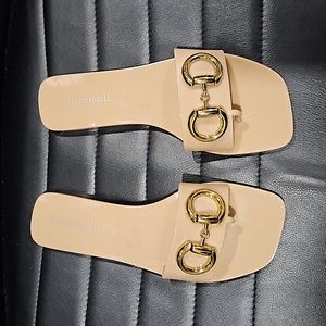 Jeffrey Campbell sleek and shiny sandal.